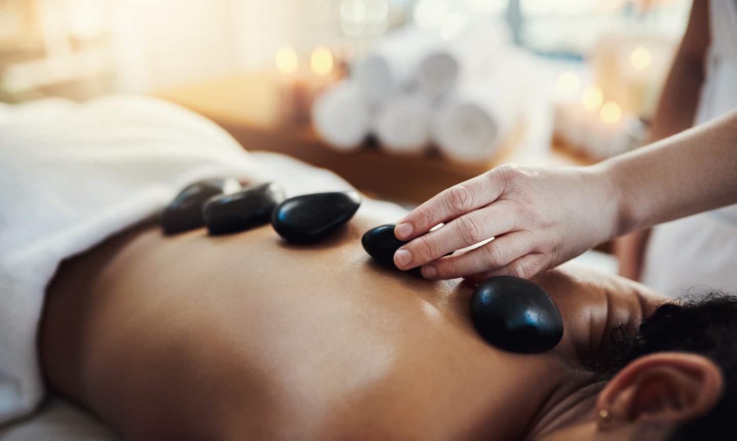 Hot stone massage therapy melts away tension